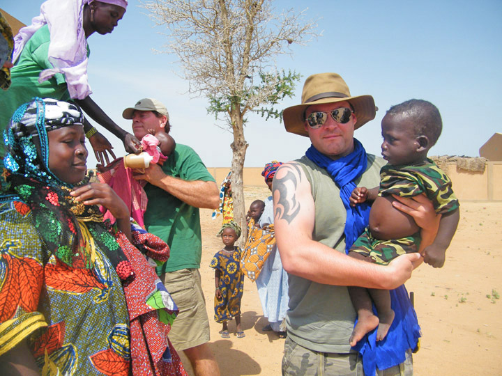 Rob and Will unloading kids with malaria at the clinic